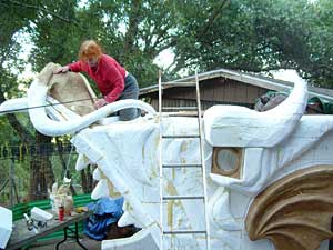 Photo of artist working on top of Dragon Tree