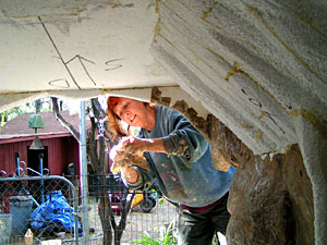 Photo of artist applying paper mache